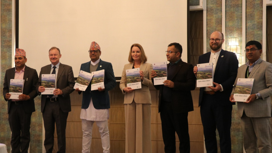 Representatives holding documents at the LEAF Coalition agreement event